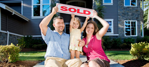 Family with sold sign